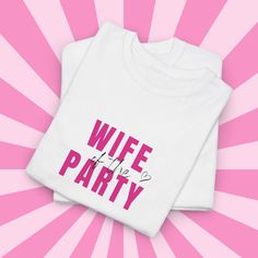 This "wife of the party" t-shirt is the perfect engagement gift or hen do outfit. The classic fit and comfy fabric make it ideal for casual wear or semi-formal occasions. Relevant for bridal showers, hen dos, and engagement celebrations. Product features - Made from strong and smooth fabric - Elastic ribbed knit collar - Ethically grown and harvested US cotton - No irritation tear-away label - Certified by Oeko-Tex for safety Care instructions - Machine wash: warm (max 40C or 105F) - Non-chlorin Hen Do Outfits, Bridal Shower Presents, Perfect Engagement Gifts, Bridal Shirts, Engagement Celebration, Bride Squad, Hen Do, Engagement Gifts, Formal Occasion