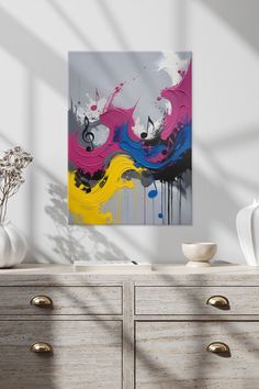 an abstract painting is displayed on a wall next to a dresser with drawers and vases