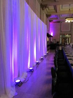 the long table is set up with purple lights