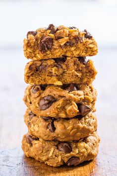 three cookies stacked on top of each other with chocolate chips and oats in the middle