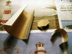 an origami model of a light house on display