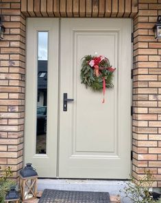 a wreath on the front door of a house