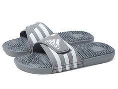 PRICES MAY VARY. Lightweight slides with soft cushioning Hook-and-loop closure for an adjustable fit Single-bandage EVA upper for lightweight comfort; EVA massage nubs on footbed Cloudfoam midsole and memory foam sockliner for step-in comfort and superior cushioning Unisex product is men's sizing. Women should size down 1 to 1.5 sizes Black And White Sneakers, Sport Sandals, Mens Sportswear, Luxury Store, Us Man, Sneaker Collection, Pharmacy Gifts, White Sneakers, Slide Sandals