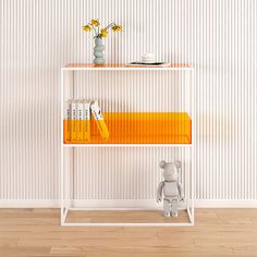 a white shelf with books and a teddy bear on the bottom, next to a striped wall