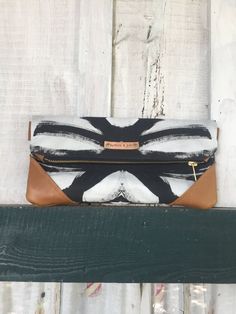 "NEW! The Vivian clutch from my Zydeco and Jazz collection made with linen cotton fabric from my textile line and 100% genuine leather.  Each clutch is unique and is hand cut and handmade for each customer. Fully lined and has brass zipper exposed. When unfolded, it measures 12\"x12\". Includes D rings for easy to attach gold chain which measures 47\" in length. Small variations in size and pattern repeat may occur. Each clutch/crossbody is custom made for each individual customer and is inspect Hand Painted Purses, Bridesmaid Clutch, Unique Clutch, Bridesmaid Clutches, Statement Clutch, Leather Clutch Purse, Foldover Clutch, White Clutch, Handmade Clutch