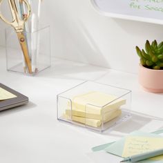 some sticky notes are sitting on a desk