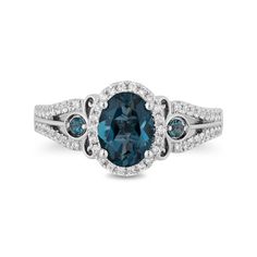 With blissful color from the Enchanted Disney Fine Jewelry Collection inspired by Cinderella, this oval-shaped blue topaz and diamond frame engagement ring is ready for a magical moment. Fashioned in 14K white gold This style features an 8.0 x 6.0mm oval-shaped London blue topaz glistening in a shimmering diamond frame. Smaller round blue topaz dot carriage motifs that punctuate the diamond-lined split shank. Crown insets gleam lower down the shank while diamonds highlight a scrolling design underneath the center stone. This engagement ring captivates with 1/3 ct. t.w. of diamonds. ©Disney Fantasy Engagement Rings Tiffany & Co., Vintage Sapphire Engagement Rings Zales, Blue Topaz Wedding Ring Sets, Blue Topez Engagement Rings, Lilo And Stitch Engagement Ring, Bleu Weeding Rings, Disney Engagement Rings Zales, Zales Outlet Engagement Rings, Zales Engagement Rings Zales