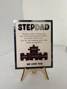 a wooden sign with a puzzle piece on it that reads, step dad thank you for coming into our lives and we didn't have to be together