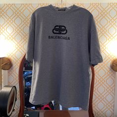 Balenciaga "Double B" Logo T-Shirt - Heather Grey - 100% Cotton - Never Worn - Made In Portugal Designer Logo Crew Neck Top, Designer Logo Tops With Crew Neck, Designer Short Sleeve Logo Top, Designer Short Sleeve T-shirt With Letter Print, Designer Crew Neck Top With Logo Print, Designer Letter Print Crew Neck Top, Designer Crew Neck Top With Letter Print, Designer Relaxed Fit Crew Neck Tops, Designer Crew Neck Shirt With Logo Print