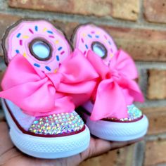 Donut Birthday Bling Shoes - Sprinkles Birthday Outfit Shoes - First Birthday  Custom Shoes - Frosting Bling Converse This listing is for a custom pair of shoes for a birthday or just because. The donut is pink, tan, purple and turquoise. The shoes are white and comes with ruffle Anklets in Pink. Your little one will love these shoes. Please do not leave children unattended while wearing the bling shoes due to the small pieces. All images are professionally pressed onto items.  These images are Pink Lace-up Sneakers For Gift, Pink Low-top Sneakers For Birthday, Pink Lace-up Sneakers For Birthday, Pink Round Toe Sneakers For Birthday, Cute Custom Pink Sneakers With Round Toe, Cute Pink Custom Sneakers With Round Toe, Fun High-top Sneakers For Birthday, Cute High-top Sneakers For Birthday, Cute Low-top Sneakers For Birthday