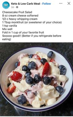 a white bowl filled with fruit salad on top of a table