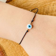 Evil Eye adjustable Bracelet it is made with quality Jewerly materials and it fits very comfortably Adjustable Casual Wristband Bracelet, Adjustable Beaded Bracelets With Evil Eye For Friendship, Adjustable Beaded Bracelets With Waxed Cord As Gift, Adjustable Bracelets With Nylon Cord, Resizable Beaded Bracelets As Gift, Trendy Resizable Jewelry With Nylon Cord, Trendy Adjustable Evil Eye Friendship Bracelets, Adjustable Evil Eye Bracelet With Sliding Knot, Adjustable Evil Eye Friendship Bracelets For The Beach