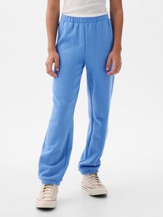 Soft cotton-blend joggers.  Elasticized waist.  Front slant pockets.  Gap arch logo at hip.  Elasticized at tapered leg.  Easy pull-on waist.  Easy through the hip and thigh.  Tapered leg. Gap Sweatpants, Cute Sweatpants, Blue Sweatpants, Arch Logo, Soft Joggers, Kids Jogger, Support People, Gender Equality, Vintage Soft