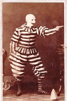 an old photo of a man dressed as a jail - cellier with his arms outstretched