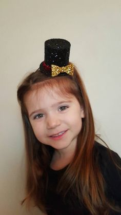 "Mini Ringmaster hat measures approx 3 1/2\" tall and approx 3\" diameter Perfect touch to the adorable romper shown here made by the shop everafterfairytales..romper not included in this listing... Elastic headband sized to fit adult or child..please leave a note at checkout regarding age of Child Made from our non shedding super sparkly glitter material" Adjustable Themed Costume Accessories For Birthday, Themed Mini Hat Cap For Costume Party, Themed Mini Cap For Costume Party, Novelty Mini Hats For Birthday And Halloween, Fun Party Mini Hat With Curved Brim, Novelty Mini Hats With Curved Brim For Party, Novelty Mini Hat With Curved Brim For Party, Adjustable High Crown Top Hat For Themed Events, Adjustable Playful Costume Accessories For Birthday