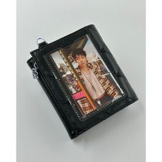 a black wallet with a photo on it