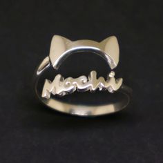 Discover our unique cat ears ring.  Designed and made for cat lovers, enthusiasts, Vet doctors, and more. Simple & Unique make the wearer stand out and as a conversation starter. Great gift for Mother and Daughter during Mother's Day.  Buy for a wife who loves the cat so much. If you require any other cat-type ear or any other jewelry style such as a bracelet, earring, or necklace, please contact us for custom design. (Affordable Prices!) Base Material: Sterling Silver Ring Depth: 13mm Ring Size Silver Cat, Unique Cats, Cat Earrings, Memorial Jewelry, Cat Ears, Metal Stamping, Minimalist Fashion, Rings Statement, Mother Gifts