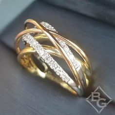 two tone gold and diamond ring on display