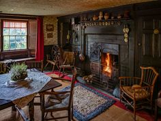 a living room filled with furniture and a fire place