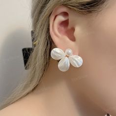 Dainty white flower pearl stud earrings, this pearl earring can be used as a reward for yourself or as a gift for a friend. Perfect gifts for happy birthday, New Year, Valentine's Day, Mother's Day, Thanksgiving Day, Chrism. ✨Product Details 𖧹 Base Metal: Sterling Silver (S925) 𖧹 Pearl Size: 10mm 𖧹 Gemstone: Mother Of Pearl 𖧹 Two studios (New York and Florida): Handcrafted in NY Studio  ✨Our jewelry is packaged in an ornament box or envelope. To avoid waste, usually more than one item will b White Flower-shaped Earrings For Party, White Flower-shaped Party Earrings, White Pearl Clip-on Earrings For Party, Pearl White Flower Drop Earrings, Flower Shaped Pearl Earrings With Pearl Drop, Pearl Drop Bridal Earrings With Flower Shape, White Round Pearl Earrings For Party, Pearl White Flower-shaped Earrings For Party, White Round Flower Earrings For Wedding