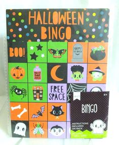 the halloween bingo game is on display in front of a white background with polka dots