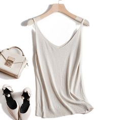 Elegant Sleeveless Sweater Vest For Summer, Sleeveless Sweater Vest For Summer, Beige V-neck Tank Top With Built-in Bra, Sleeveless Seamless Sweater Vest For Summer, Chic Cami Sweater Vest For Summer, V-neck Sweater Vest For Summer, Beige Seamless Sleeveless Camisole, Summer Seamless Tank Sweater Vest, Lurex Top