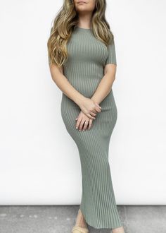 Subtle yet bold - this short sleeve fitted knit midi dress is a staple for the spring season. Featuring a high boat neck, stretch ribbed knit, and 1/4 sleeves. Can be dressed up or down with either sneakers and a denim jacket, or heels and a leather jacket! Model is 5'3" and wears the size 4. Materials: 65% viscose, 35% nylon. Designed in Australia. *SALE ITEMS ARE FINAL SALE & CANNOT BE RETURNED* Return Policy Green Ribbed Midi Dress, Casual Green Ribbed Midi Dress, Trendy Stretch Sweater Dress Midi Length, Chic Spring Midi Dress With Ribbed Neckline, Knee-length Ribbed Knit Midi Dress, Fitted Ribbed Sweater Dress For Spring, Trendy Stretch Sweater Dress For Spring, Trendy Ribbed Midi Dress For Spring, Spring Fitted Midi Dress With Ribbed Neckline