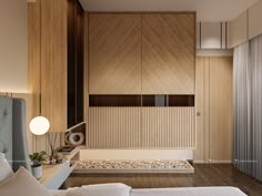 a bedroom with wood paneling and white bedding in the corner, next to a wooden wall