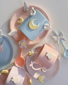 three plates with baby items on them sitting next to each other