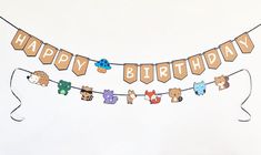 a happy birthday banner with teddy bears hanging from it's side on a string