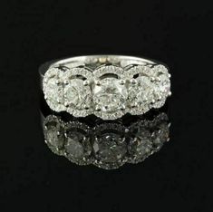 an antique diamond ring with five stones