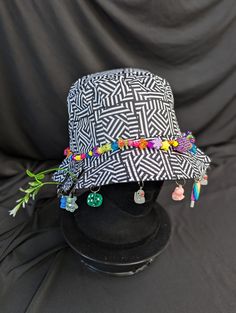 -hat color - black and white trippy -bead color - rainbow -charm color - rainbow -unisex adult size -inner circumference - 22.5in -crown dip - 3in -brim - 2.25in -NOT machine washable -Perfect for raves and outdoor festivals! Shipping within the US USPS First Class Package 3-9 days USPS Priority Mail 1-5 days USPS Priority Mail Express 1-3 days Shipping International  USPS First Class Mail International  -Varies- USPS Priority Mail International 6-14 days USPS Priority Mail Express International 3-9 days Shipping times are estimated, NOT GUARENTEED.  +International buyers are responsible for all import fees+ +Orders of $50+ may require signature confirmation upon delivery+ Rave Hat, Trippy Rainbow, Rainbow Festival, Rave Hats, Rave Fit, Festival Fits, Rave Fits, Festival Ideas, Rave Gear