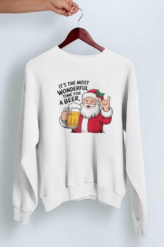 Festive Beer-Themed Sweatshirt: Celebrate the holiday season with this fun beer-themed Christmas sweatshirt, perfect for adding some holiday cheer to your wardrobe.   Comfortable Cotton Fabric: Made from 100% soft cotton, this sweatshirt provides warmth and comfort, making it ideal for wearing throughout the festive season.   Unisex Fit: Designed with a relaxed, unisex fit that works for both men and women, making it versatile for any casual holiday occasion.   Great Gift Idea: An excellent gift Christmas Sweater Ideas, Beer Christmas, Xmas Funny, Sweater Ideas, Beer Theme, Jumper Outfit, Themed Christmas, Mens Hoodies, Funny Sweatshirts