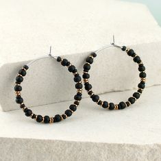 Small, black, beaded hoop earrings. ‣ Japanese glass seed beads in matte black and shiny, metallic bronze or hematite ‣ handmade, polished, small earring hoops - made of 316L stainless steel * SIZE: ‣ approx Ø: 1.1" / 2.7 cm ‣ beads: 2-3 mm They are very lightweight, comfortable little hoops. * COLORS (Choose from the drop-down menu): ‣ BLACK - BRONZE ‣ BLACK - HEMATITE Click here for more beaded hoop earrings: www.etsy.com/shop/LianuDesign?ref=seller-platform-mcnav%C2%A7ion_id%C2%A7ion_id§ion_i Premium Black Small Hoop Jewelry, Cheap Black Hoop Earrings With Round Beads, Cheap Black Beaded Earrings With Round Beads, Seed Bead Hoop Earrings, Earrings Japanese, Bead Hoop Earrings, Earring Hoops, Small Hoop Earrings, Black Seed