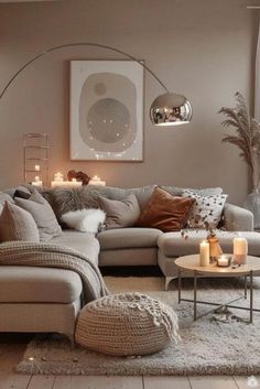 a living room filled with furniture and candles