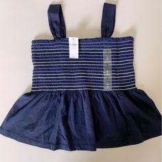 Nwt Gap Kids Smocked Tank Size M (8) Navy Cotton Tops With Smocked Bodice, Sleeveless Smocked Cotton Top, Blue Cotton Smocked Top, Fitted Blue Cotton Smocked Top, Fitted Blue Tops With Elastic Waistband, Casual Cotton Smocked Top With Smocked Cuffs, Casual Blue Cotton Smocked Top, Casual Blue Top With Smocked Back, Kids Smock