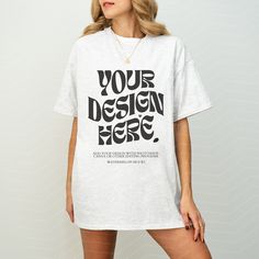 a woman wearing a white t - shirt with the words your design here printed on it