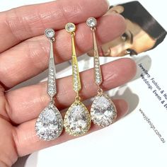 "A pair of linear drop dangle cz drop 1920s vintage style Art Deco bridal earrings with pave bar posts and sparkly clear cubic zirconia teardrop dangles. Dainty, stunning and lightweight jewelry in your choice of tarnish-resistant m silver rhodium, yellow gold or rose gold base. Earrings are about 2\" (5cm) with posts. View all our collections at yjdesign.com.au" Classic Drop Crystal Earrings For Party, Classic Drop Chandelier Earrings For Wedding, Classic Long Drop Chandelier Earrings For Wedding, Classic Long Drop Wedding Earrings, Classic Long Drop Earrings For Wedding, Sparkling Long Drop Wedding Earrings, Long Drop Silver Crystal Earrings For Weddings, Wedding Long Drop Teardrop Earrings, Long Drop Teardrop Earrings For Wedding