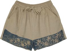 Invest in a sustainable and unique piece for your wardrobe with this pair of artistic hippie handmade embroidered fern shorts. Made with beige canvas cotton, these shorts feature intricate green fern embroidery on the hem panels that add a touch of nature-inspired charm. #tlb #bohemianfashion #Handmade #hippieshorts Bohemian Embroidered Beige Bottoms, Beige Bohemian Embroidered Bottoms, Casual Embroidered Beige Bottoms, Spring Bohemian Shorts, Bohemian Shorts For Spring, Casual Embroidered Shorts With Relaxed Fit, Casual Embroidered Relaxed Fit Shorts, Cotton Hippie Shorts, Bohemian Embroidered Cotton Shorts