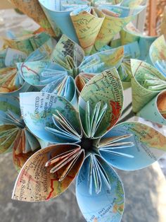 an origami flower made out of maps