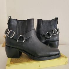 Polished Hardware Highlights The Harness Strap Of An Edgy Bootie Lifted By A Just-Right Block Heel. 2" Heel; 1/2" Platform (Size 8.5) 5 1/2" Shaft Leather Or Genuine Calf-Hair (Vietnam) Upper/Synthetic Lining And Sole Silver Boots With Medium Width For Fall, Silver Boots Medium Width For Fall, Leather Boots With Silver Accents And Round Toe, Trendy Silver Leather Boots, Silver Boots With Buckle Closure And Round Toe, Silver High Heel Boots Medium Width, Silver Pointed Toe Boots With Buckle Closure, Faux Leather Mid-calf Boots With Platform Block Heel, Black Leather Mid-calf Boots With Lug Sole