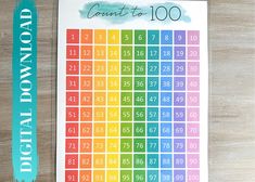 a rainbow colored calendar on a wooden table