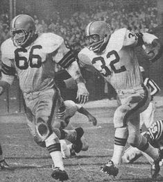 an old black and white photo of football players