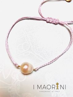 * Delicate Bracelet made of lilac cotton with central freshwater pearl inserted with golden    silver thread and elements in gilded satin silver. * Adjustable string Bracelet. * The simplicity of this delicate bracelet allows you to wear it daily and adapt it to any    outfit. * Measurements the pearl: 1 cm * 100% handmade * You will receive the article in the photo. IMAORINI realizes unique pieces. * To protect the jewel and preserve it from dust it, is good practice to store it in a soft bag    or in a closed box. *Thanks for shopping at IMAORINI.  If you have any questions, please contact me! ✉ Copyright © 2022 IMAORINI | All rights reserved Adjustable Pink Pearl Bracelet With Pearl Drop, Elegant Pink Bracelet With Sliding Knot, Pink Pearl Drop Bracelet, Adjustable Handmade Rose Gold Pearl Bracelet, Adjustable String Bracelet, Soft Bag, Gold Ceramic, String Bracelet, Delicate Bracelet