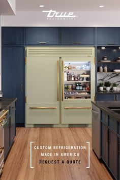 a kitchen with blue cabinets and gold trim on the doors is featured in an article about custom refrigeration made in america