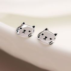 These sterling silver cat stud earrings are perfect for all ages - making them the ideal gift for children, best friends and cat lovers alike. Not to be found anywhere on the high street, our beautiful cat studs are crafted from the finest sterling silver. Featuring a tiny kitten's face with beautifully oxidised eyes, nose, and whiskers, these lovely cat earrings feature a classic butterfly and post fastening and are suitable for almost any age. Make your earrings even more special by choosing o Cat Stud Earrings, 13th Birthday Gifts, Cute Cat Face, Cat Earrings Studs, Tiny Kitten, Sterling Silver Cat, Face Earrings, Moustaches, Bespoke Gifts