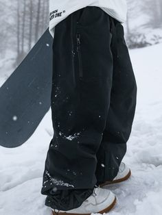 These baggy snowboard trousers are crafted with simplicity in mind, offering a contemporary, relaxed fit that's both stylish and functional. Designed to keep you dry on the slopes, they feature waterproof technology that ensures you stay comfortable no matter the weather. Step into a world of effortless style and reliable performance with our unisex nandn baggy ski pants, and conquer the mountain with confidence. Face Fabric & Lining Material Nylon & Polyester Membrane 10K Waterproof / 10K Breat Black Ski Outfits For Women, Steezy Ski Outfits, Baggy Ski Fit, Baggy Ski Pants, Snow Pants Outfit