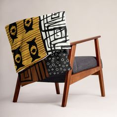 a chair that has some kind of blanket on it