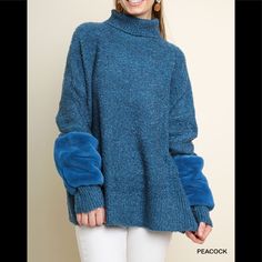 Umgee Long Sleeve Turtleneck Knit Pullover Sweater With Faux Fur Sleeve Detail In Peacock Blue Blue Turtleneck Sweater With Ribbed Cuffs, Blue Sweater With Ribbed Cuffs For Winter, Cozy Blue Sweater For Fall, Blue Soft Knit Turtleneck Sweater, Blue Winter Tops With Ribbed Cuffs, Oversized Blue Turtleneck Sweater, Cozy Fit Blue Knit Sweater, Blue Oversized Turtleneck Sweater, Winter Blue Sweater For Layering