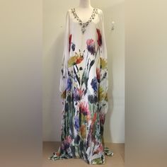 Badgley Mischka Beaded White Multi Brushstroke Watercolor Floral Caftan Dress Size Xs Nwt Kimono Sleeve, V-Neck Floral Print, Double Lining, Bead, Sequin, And Rhinestone Detail Pullover Body: 100% Silk Lining: Polyester Imported Spot Clean Includes Extra Beads Embellished Silk Maxi Kaftan, Embellished Silk Maxi-length Kaftan, Embellished Floor-length Silk Kaftan, Embellished Silk Floor-length Kaftan, Bohemian Embellished Silk Kaftan, Flowy V-neck Embellished Dress, Embellished V-neck Kaftan For Wedding, Bohemian Hand Embellished Floor-length Kaftan, Spring Embellished Kaftan For Vacation